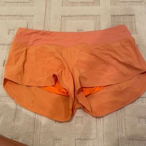 Orange Lululemon shorts size 8 reg